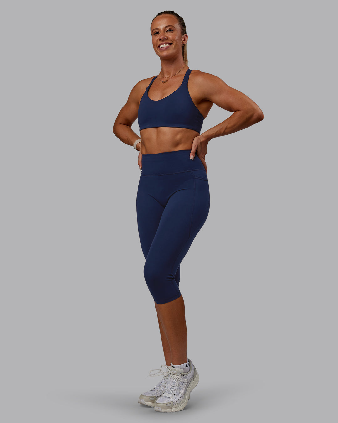 Woman wearing Fusion 3/4 Length Tights with Pockets - Future Navy