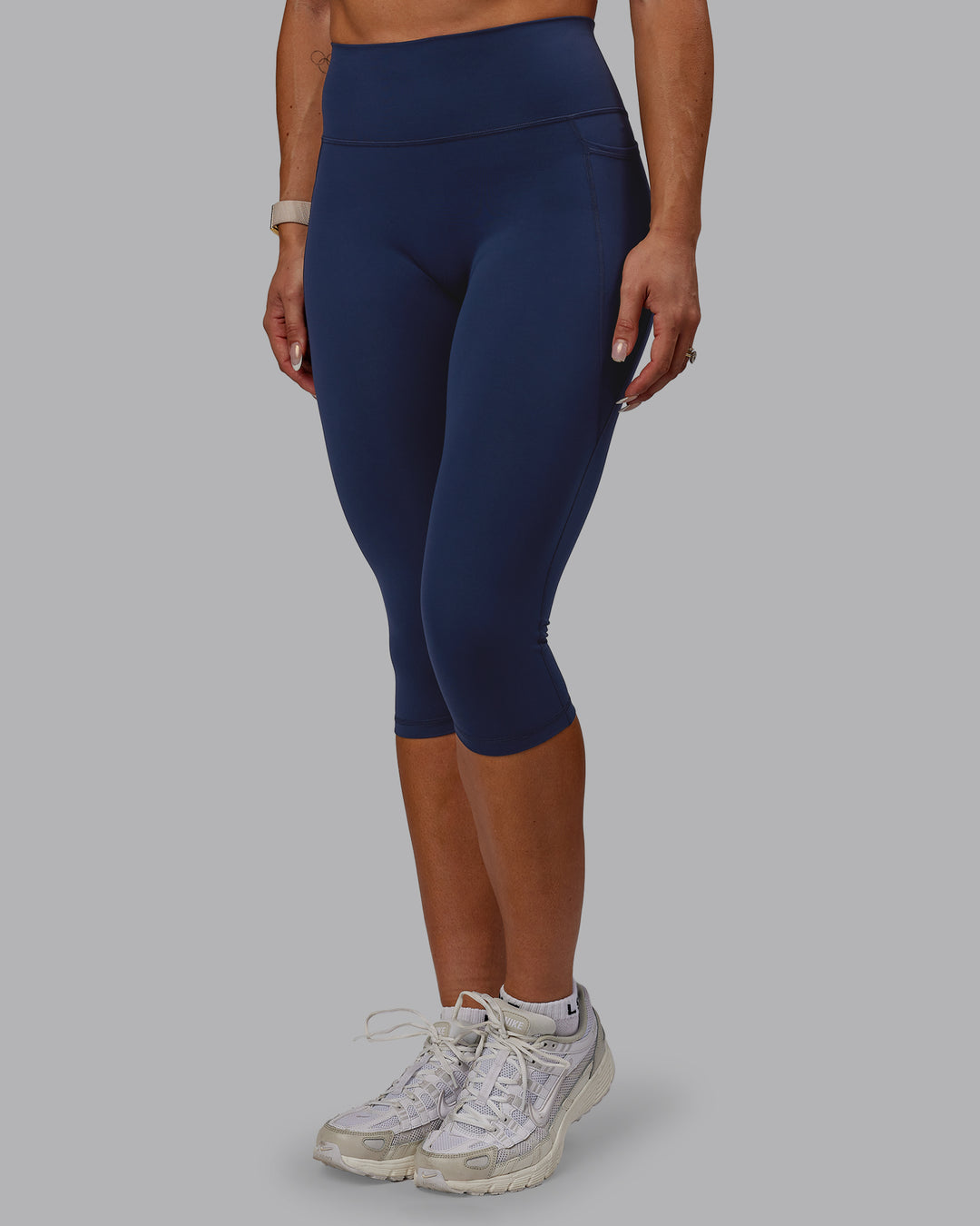 Woman wearing Fusion 3/4 Length Tights with Pockets - Future Navy