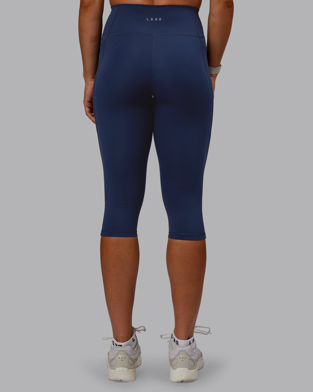 Woman wearing Fusion 3/4 Length Tights with Pockets - Future Navy