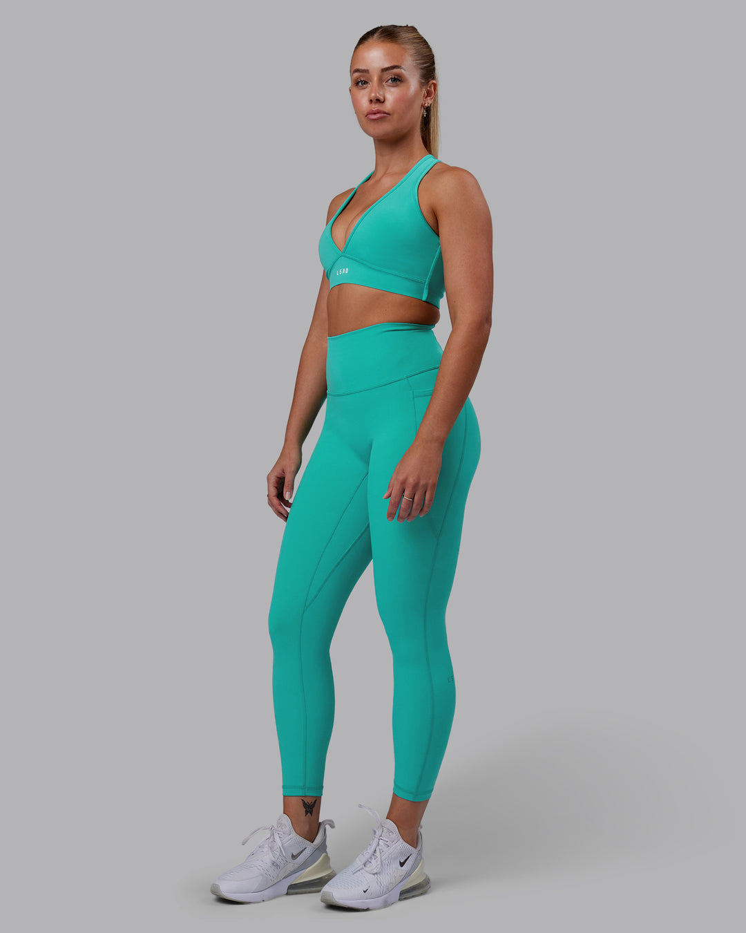 Woman wearing Fusion 7/8 Length Tights - Turquoise Tide