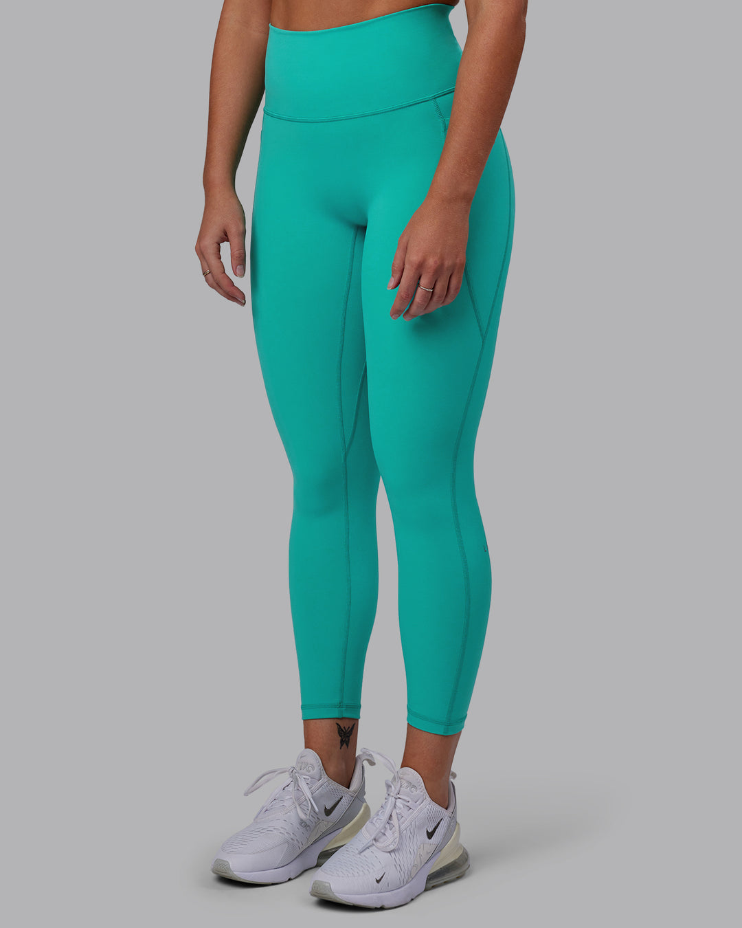 Woman wearing Fusion 7/8 Length Tights - Turquoise Tide