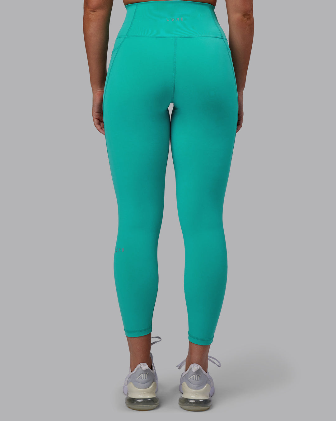 Woman wearing Fusion 7/8 Length Tights - Turquoise Tide