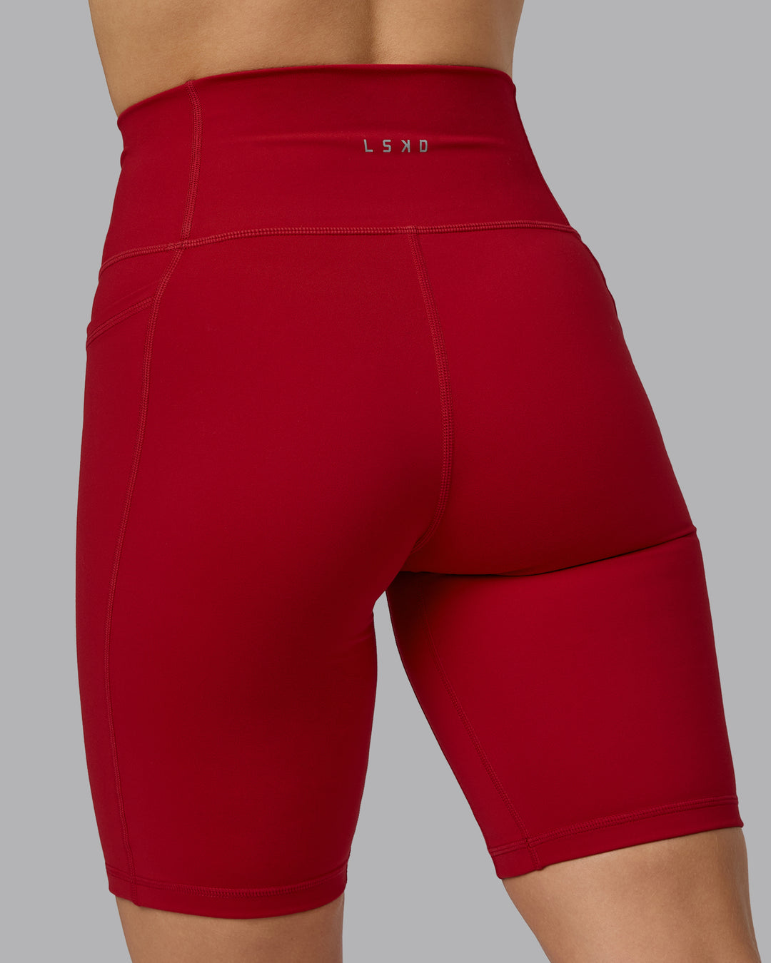 Woman wearing Fusion Bike Shorts with Pockets - Cherry Red