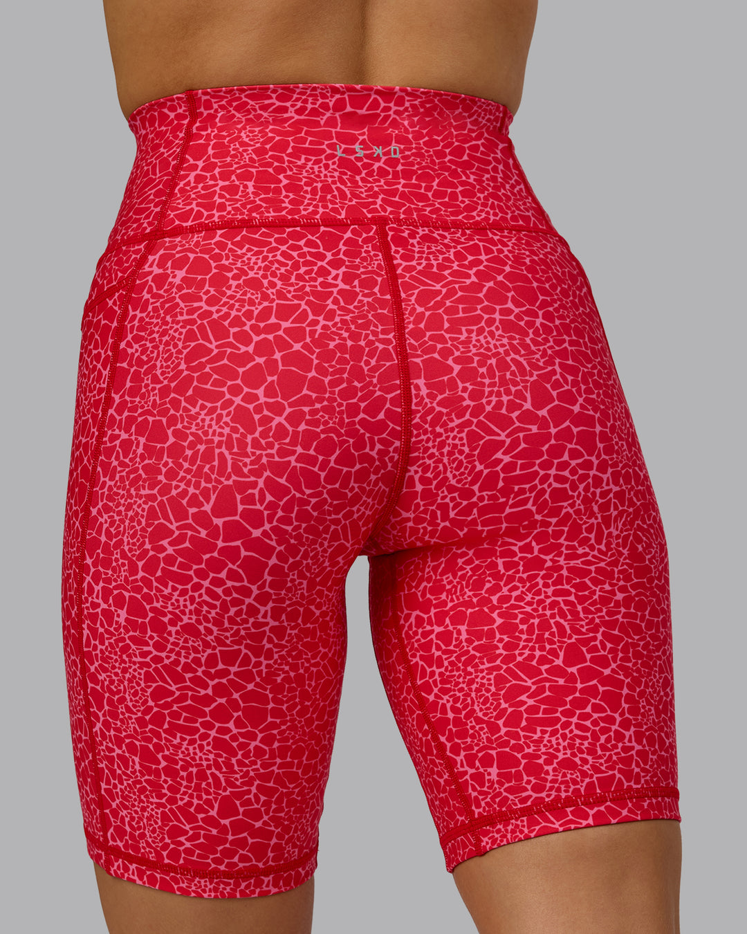 Woman wearing Fusion Bike Shorts - Red Vitality Print