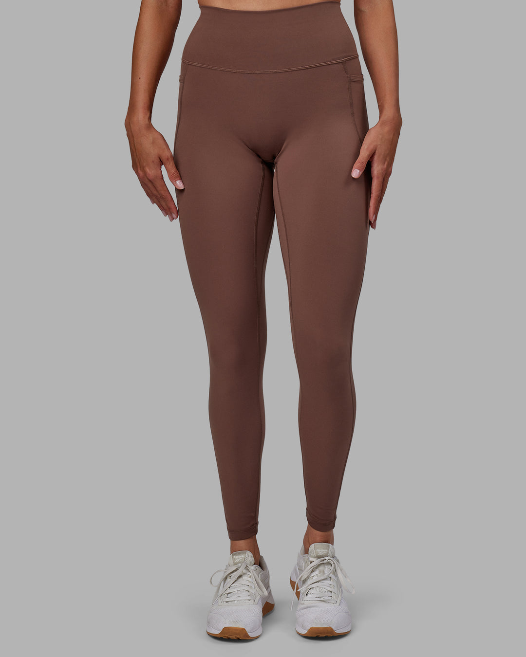 Woman wearing Fusion Full Length Tights - Dull Rust