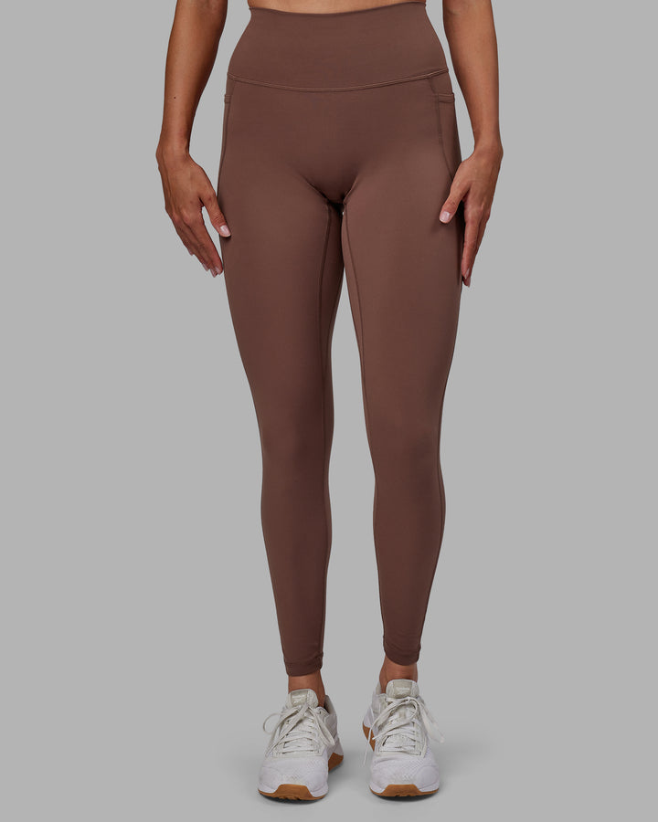 Woman wearing Fusion Full Length Tights - Dull Rust
