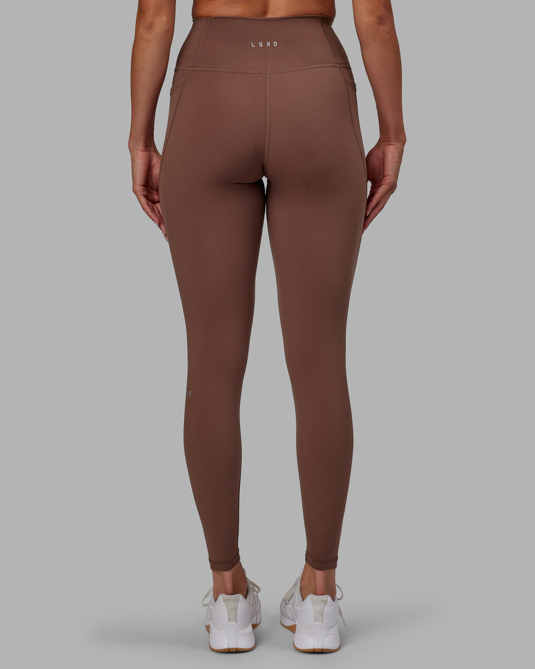 Woman wearing Fusion Full Length Tights - Dull Rust