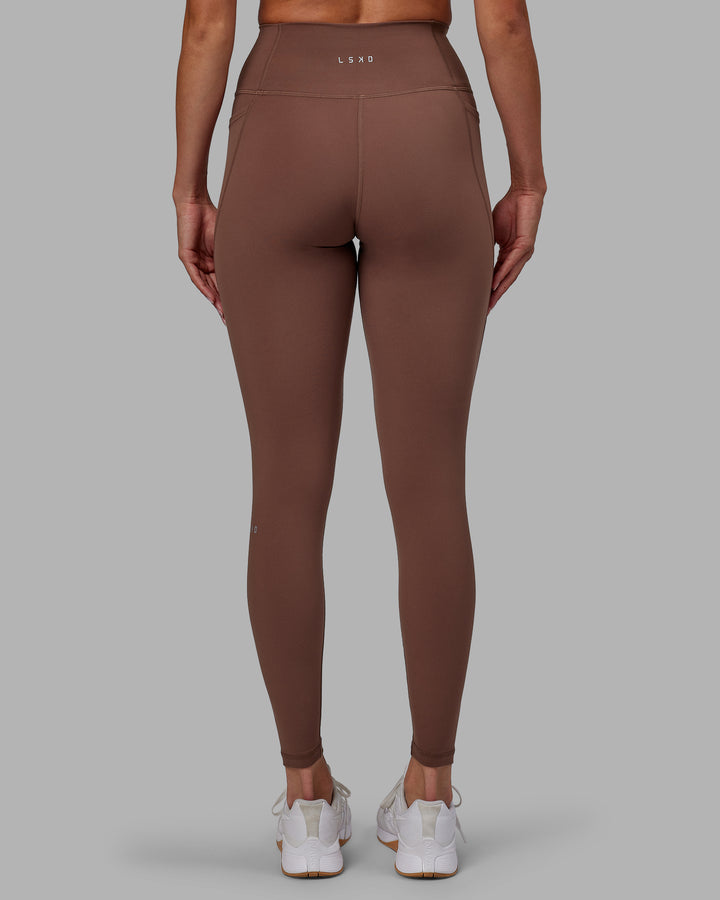 Woman wearing Fusion Full Length Tights - Dull Rust
