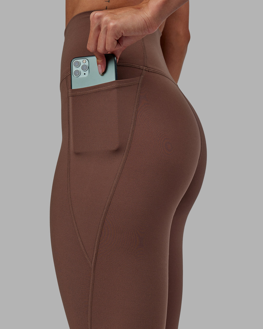 Woman wearing Fusion Full Length Tights - Dull Rust