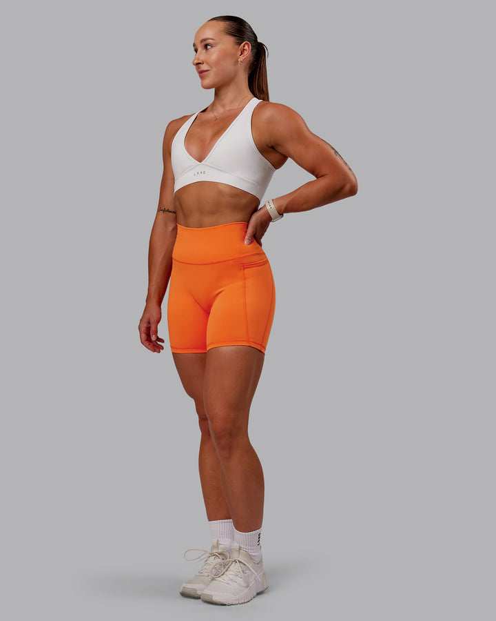 Woman wearing Fusion Mid Short Tights with Pockets - Mandarin
