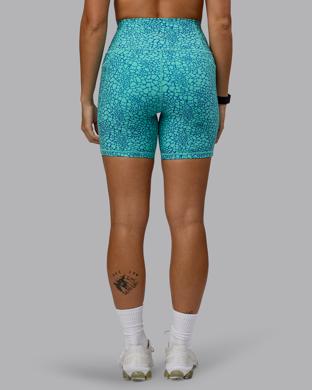 Woman wearing Fusion Mid Short Tights - Aquatic Awe Vitality Print