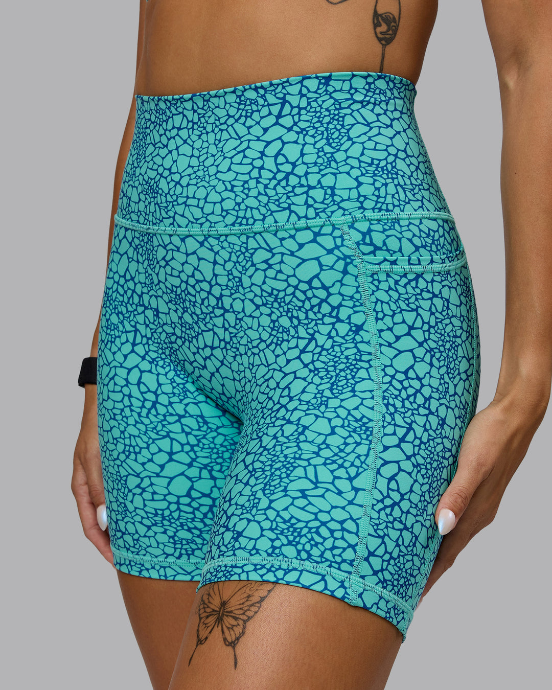 Woman wearing Fusion Mid Short Tights - Aquatic Awe Vitality Print