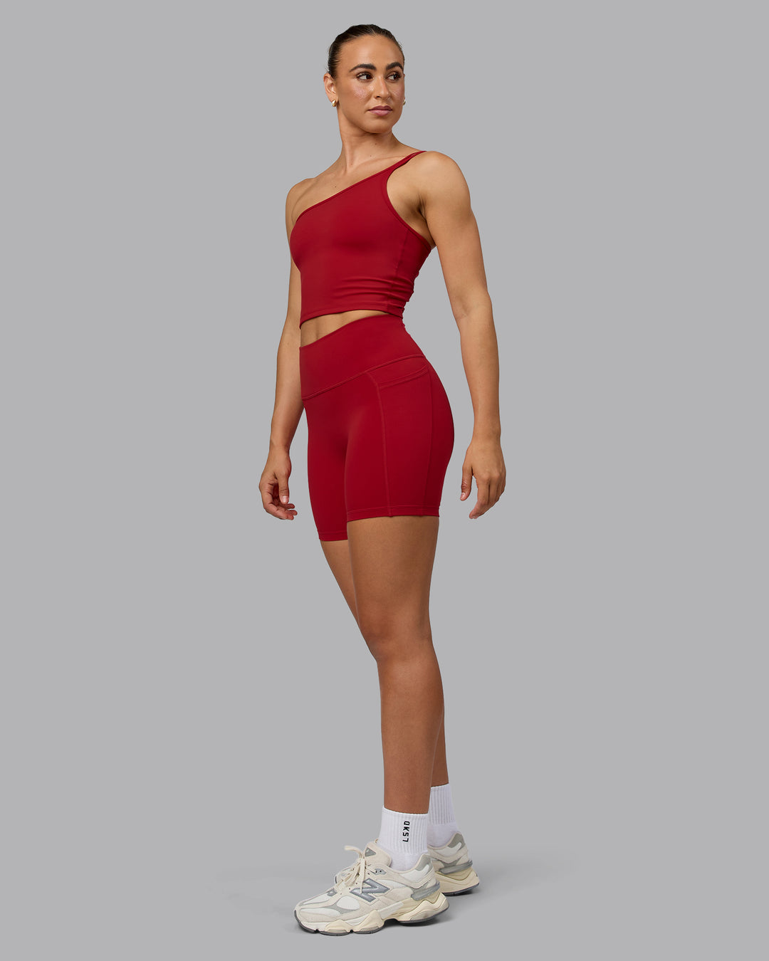 Woman wearing Fusion Mid Short Tights with Pockets - Cherry Red