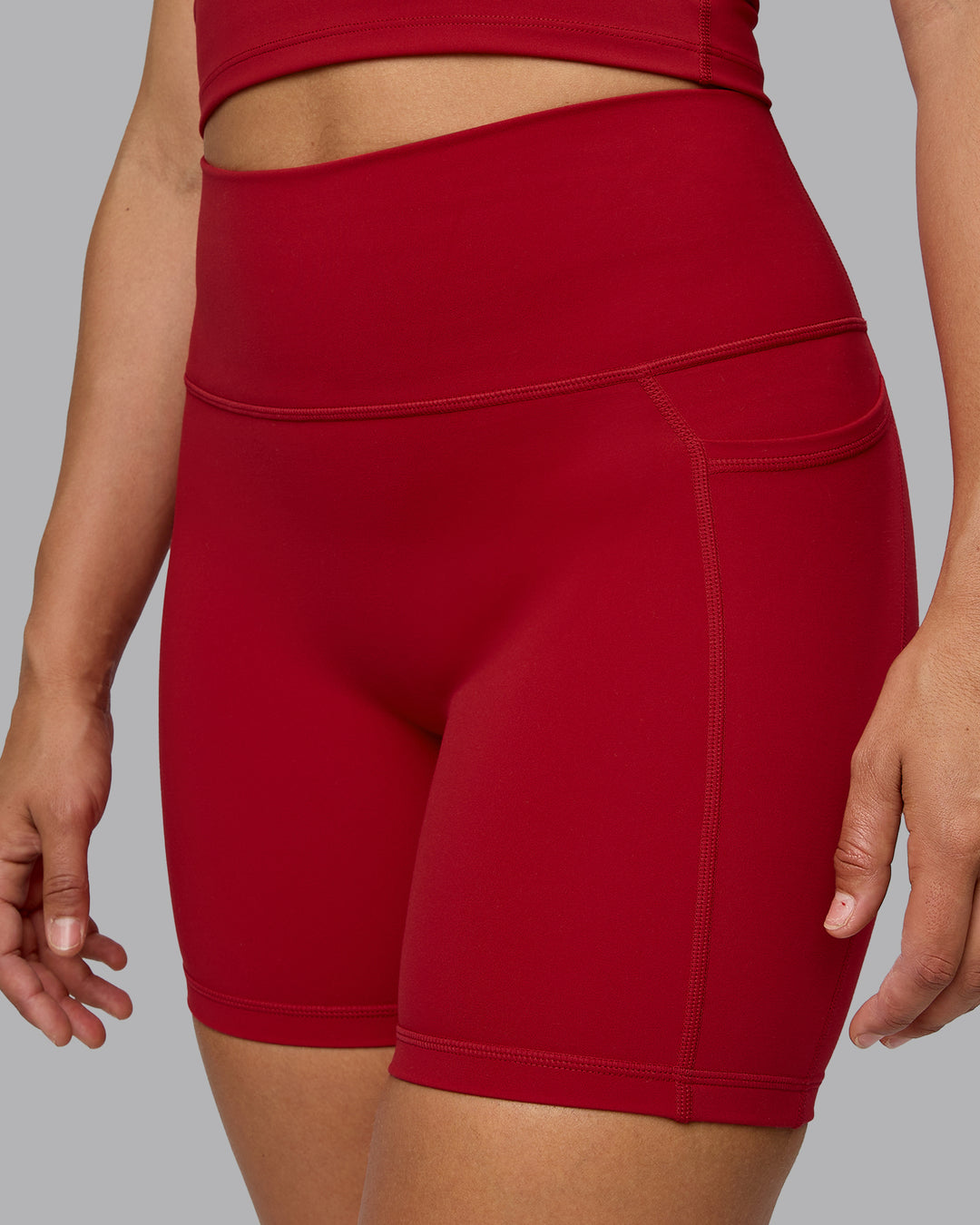 Woman wearing Fusion Mid Short Tights with Pockets - Cherry Red