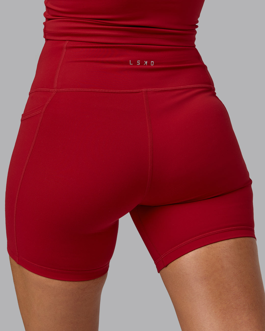 Woman wearing Fusion Mid Short Tights with Pockets - Cherry Red