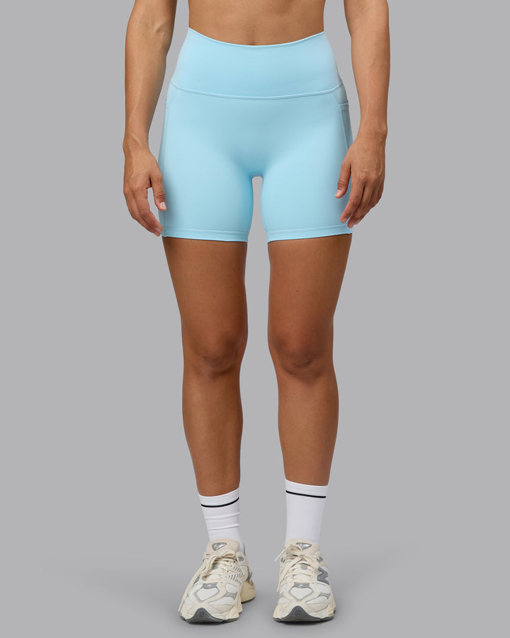 Woman wearing Fusion Mid Short Tights with Pockets - Crystal Blue
