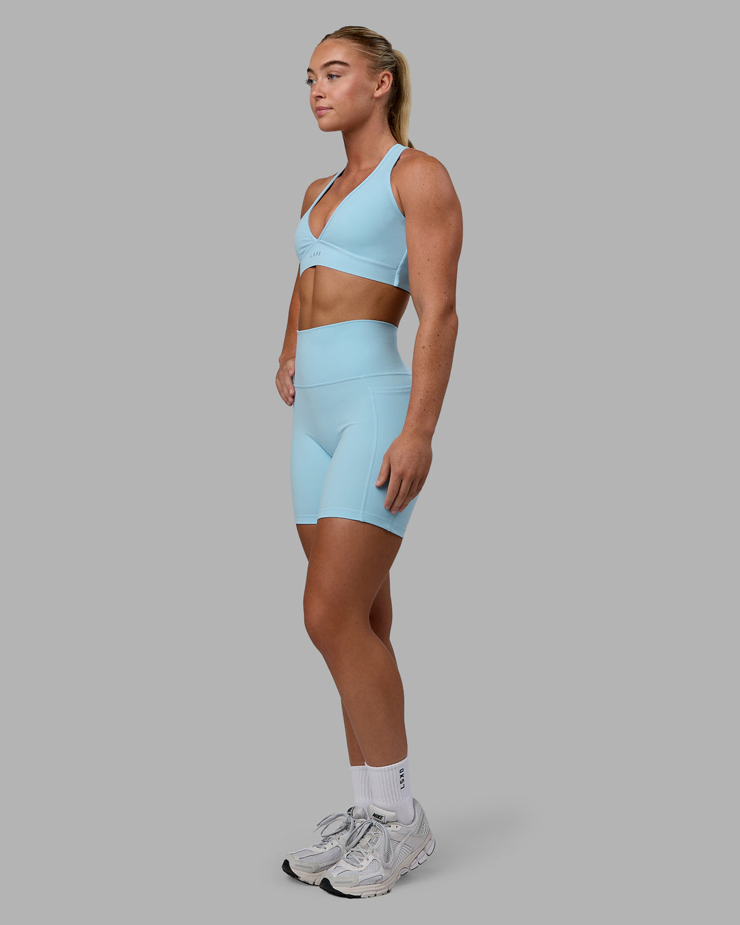 Woman wearing Fusion Mid Short Tights - Glacial Blue