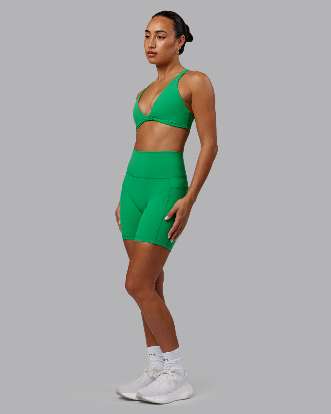 Woman wearing Fusion Mid Short Tights - Impact Green