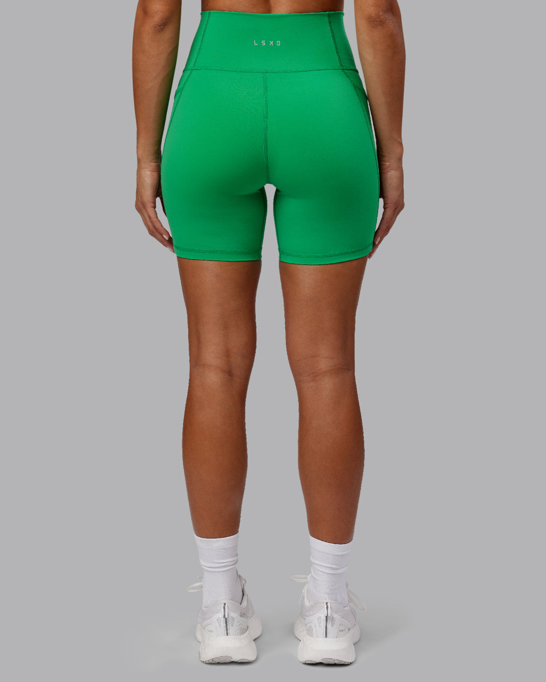 Woman wearing Fusion Mid Short Tights - Impact Green