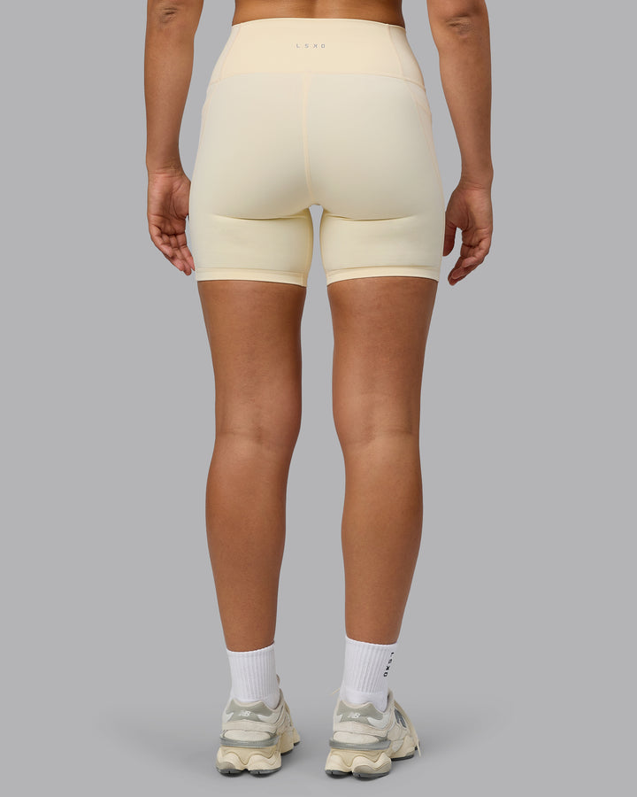 Woman wearing Fusion Mid Short Tights with Pockets - Ivory
