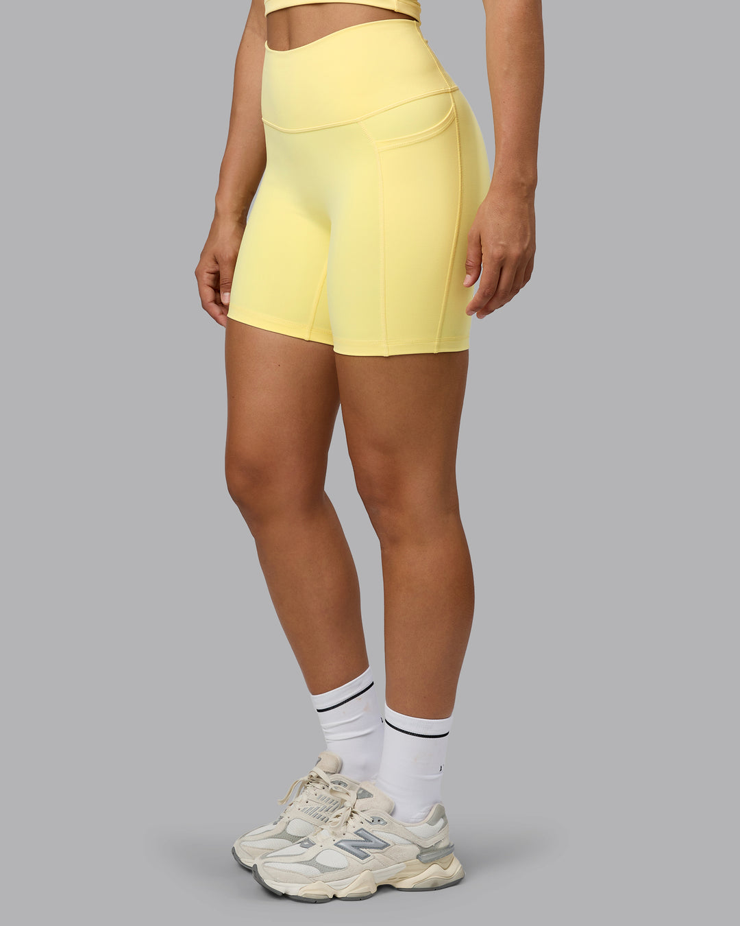 Woman wearing Fusion Mid Short Tights with Pockets - Lemon