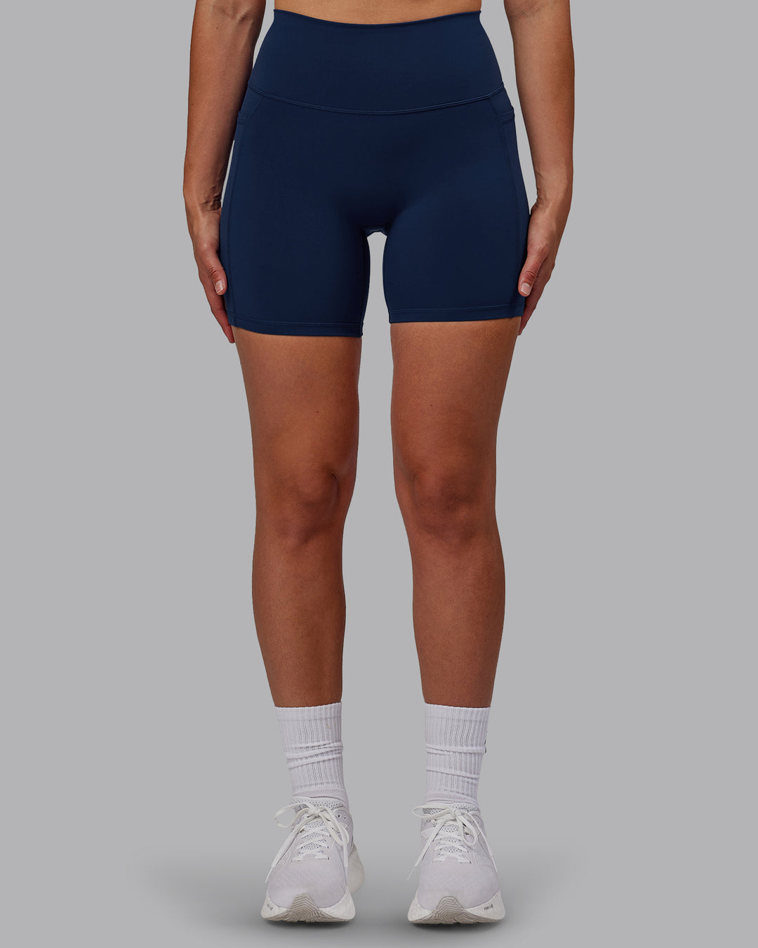 Woman wearing Fusion Mid Short Tights with Pockets - Future Navy