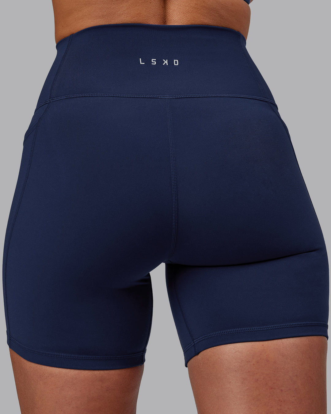 Woman wearing Fusion Mid Short Tights with Pockets - Future Navy