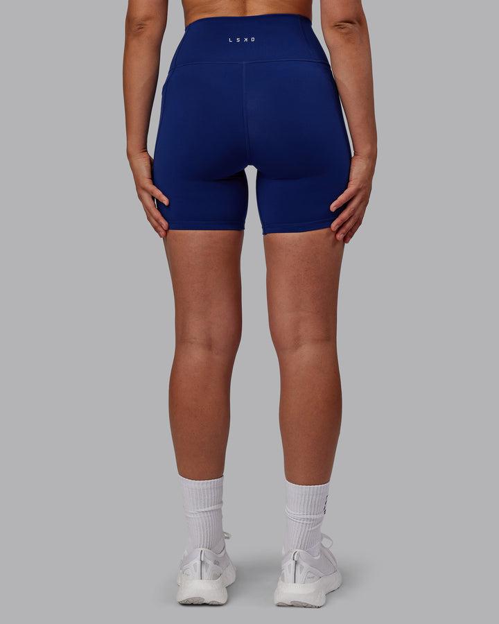 Woman wearing Fusion Mid Short Tights - Midnight Blue
