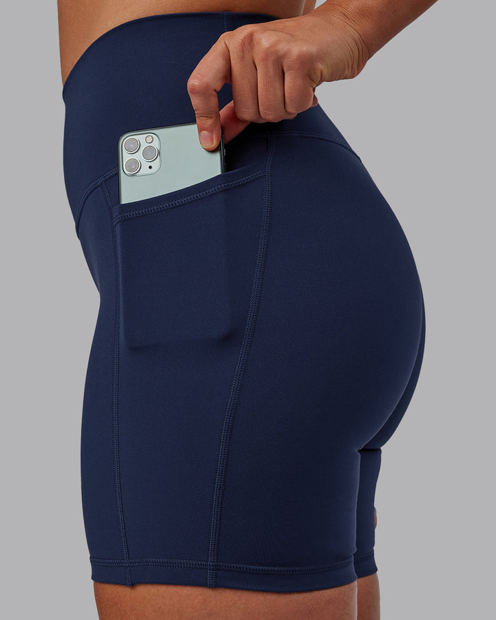 Woman wearing Fusion Mid Short Tights with Pockets - Future Navy
