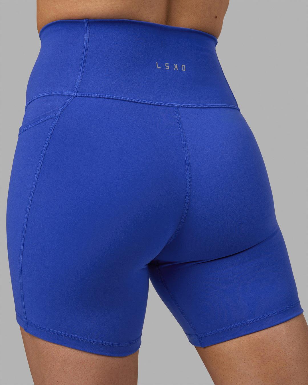 Woman wearing Fusion Mid Short Tights - Power Cobalt