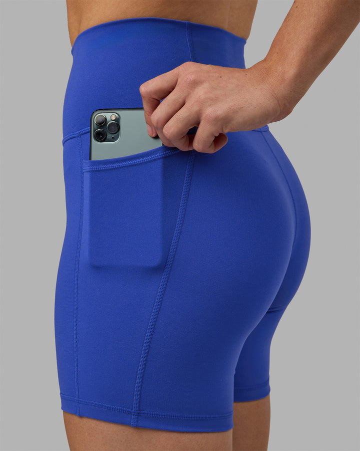 Woman wearing Fusion Mid Short Tights - Power Cobalt
