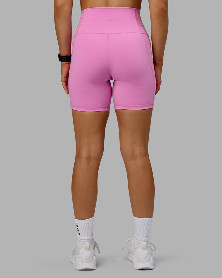 Woman wearing Fusion Mid Short Tights - Spark Pink
