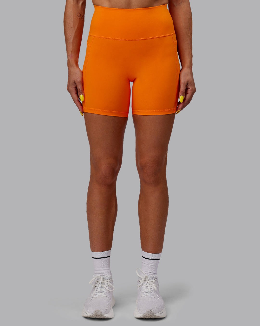 Woman wearing Fusion Mid Short Tights - Vibrant Orange