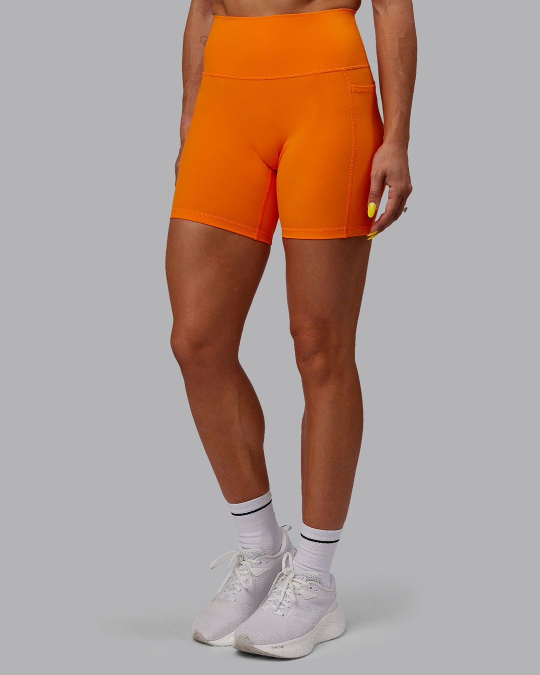 Woman wearing Fusion Mid Short Tights - Vibrant Orange