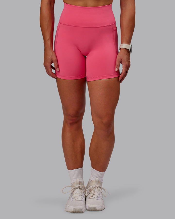 Woman wearing Fusion Mid Short Tight With Pockets - Hot Pink
