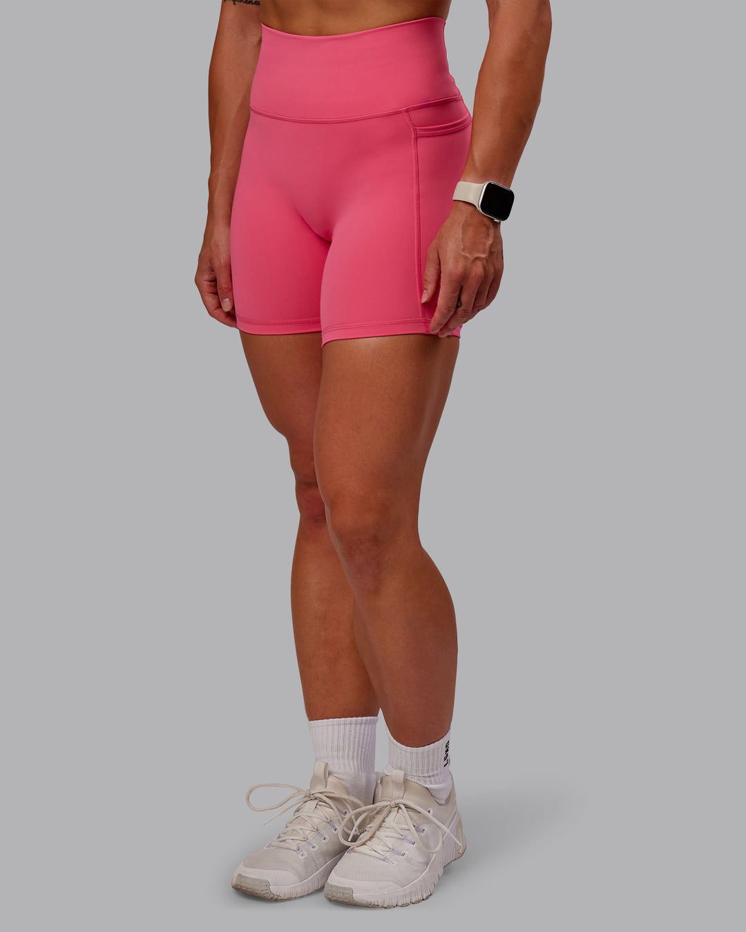 Woman wearing Fusion Mid Short Tight With Pockets - Hot Pink