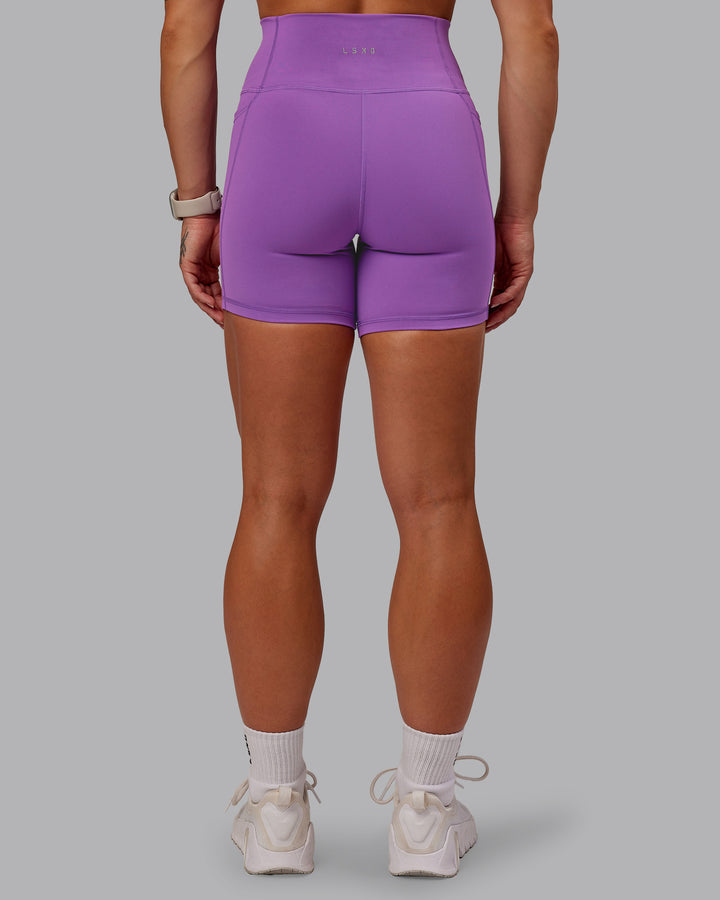 Woman wearing Fusion Mid Short Tight With Pockets - Purple Fizz
