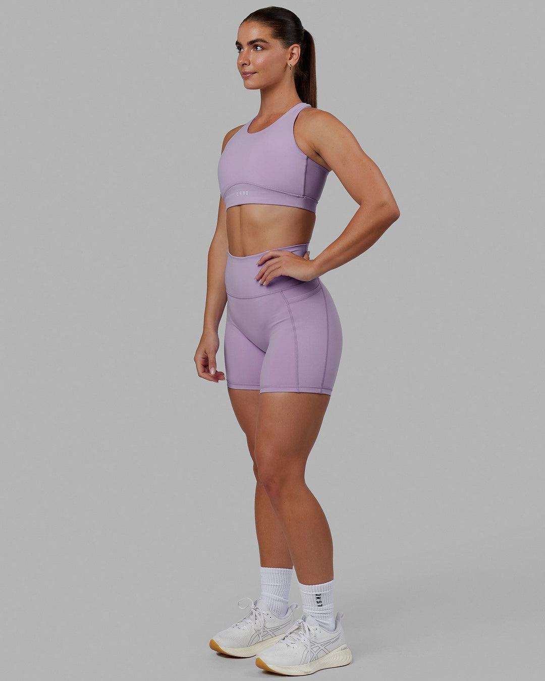 Woman wearing Fusion Sports Bra - Pale Lilac