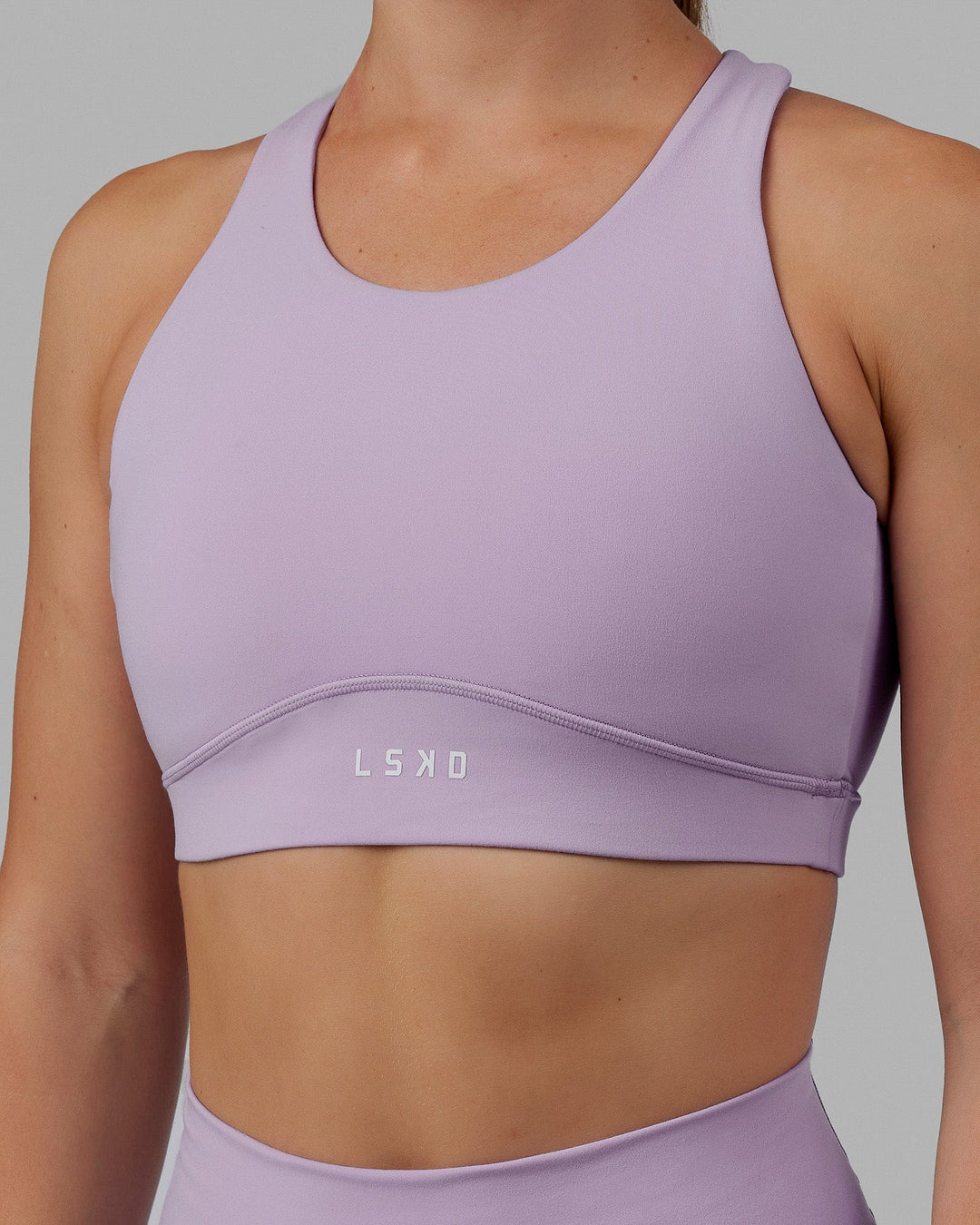 Woman wearing Fusion Sports Bra - Pale Lilac