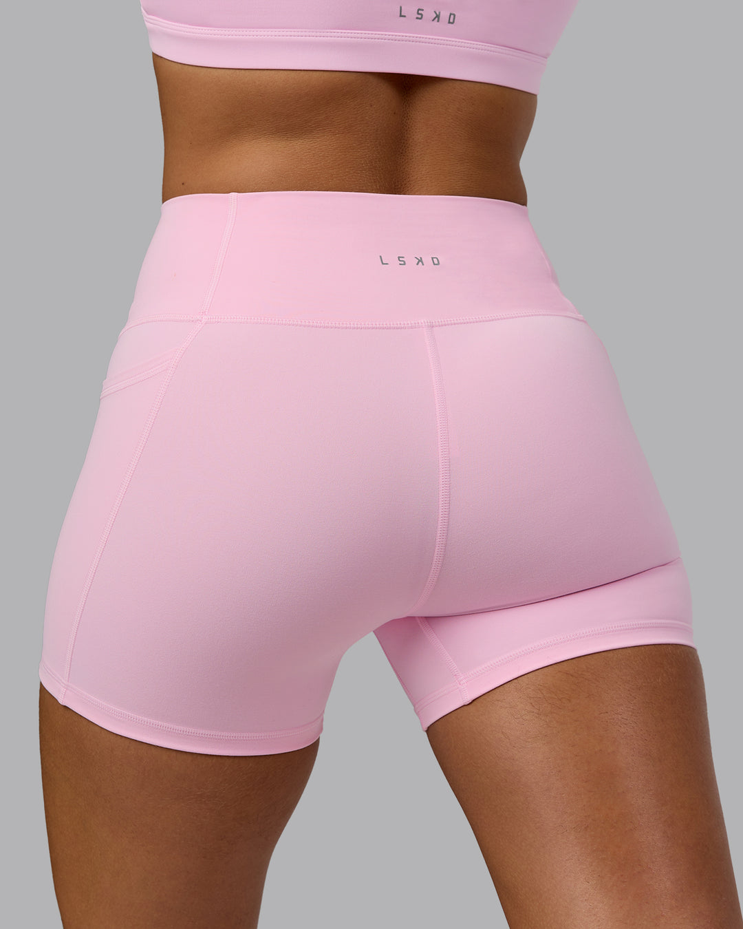 Woman wearing Fusion X-Short Tights with Pockets - Pale Pink