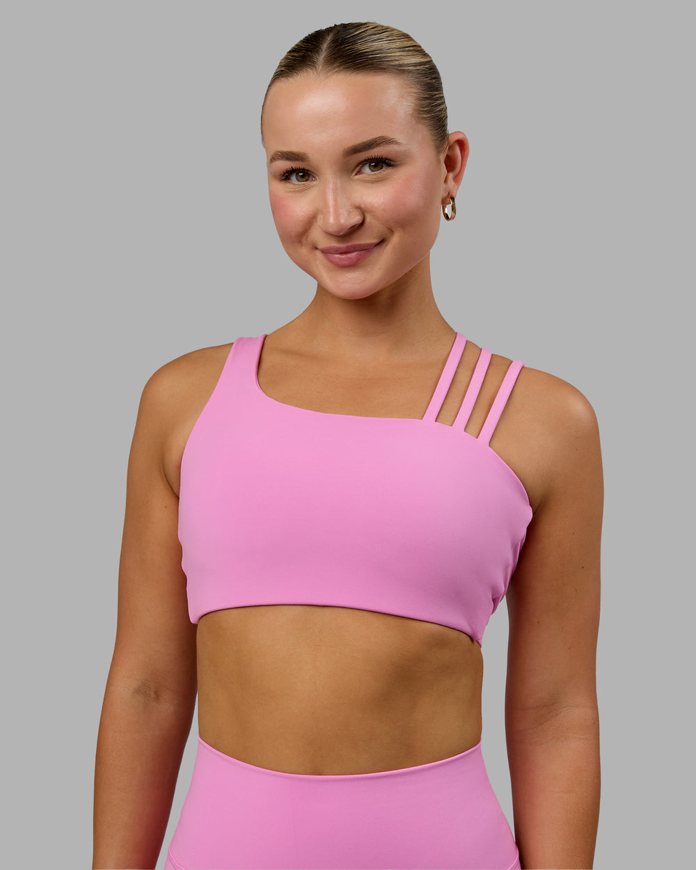 Woman wearing Galvanise Sports Bra - Spark Pink