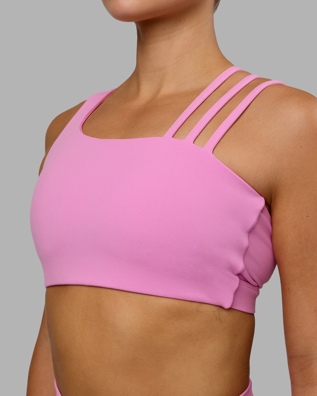 Woman wearing Galvanise Sports Bra - Spark Pink