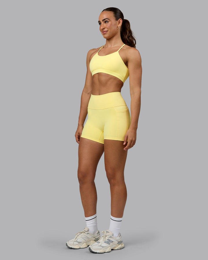 Woman wearing Glow Sports Bra - Lemon
