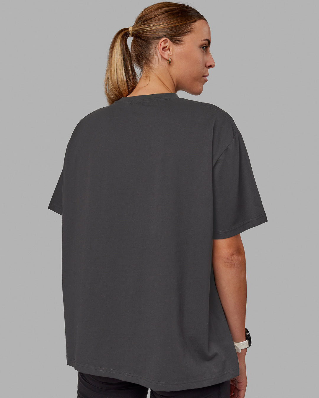 Woman wearing Go-To FLXCotton Oversized Tee - Dark Storm-White