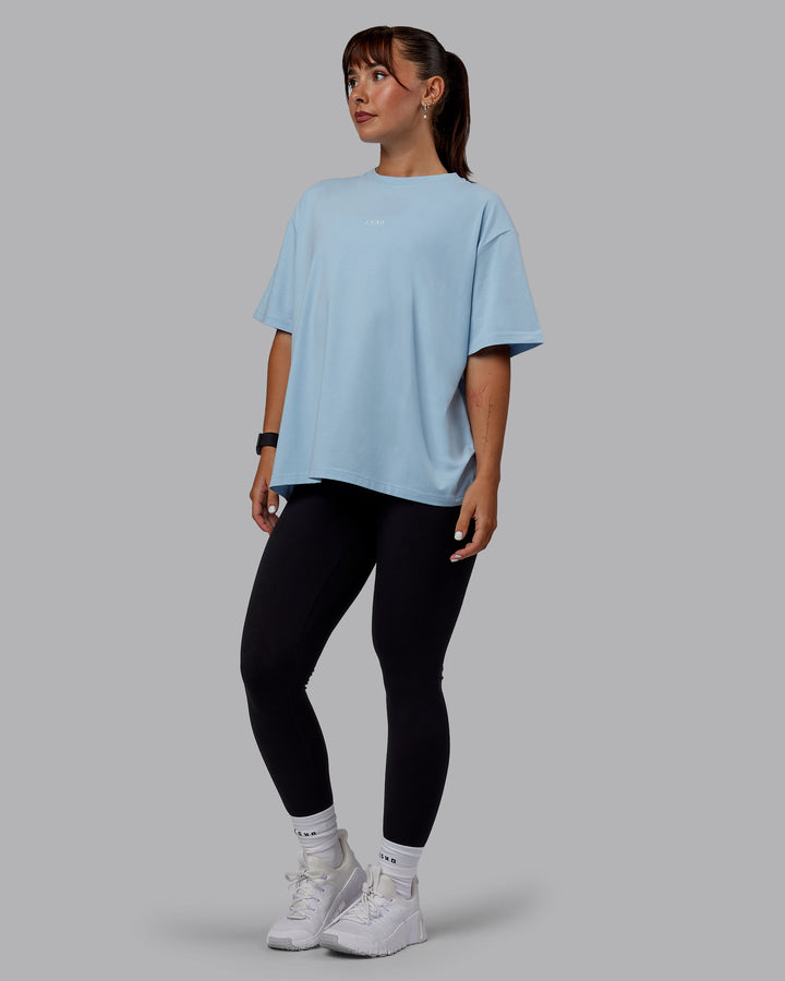 Woman wearing Go-To FLXCotton Oversized Tee - Glacial Blue-White
