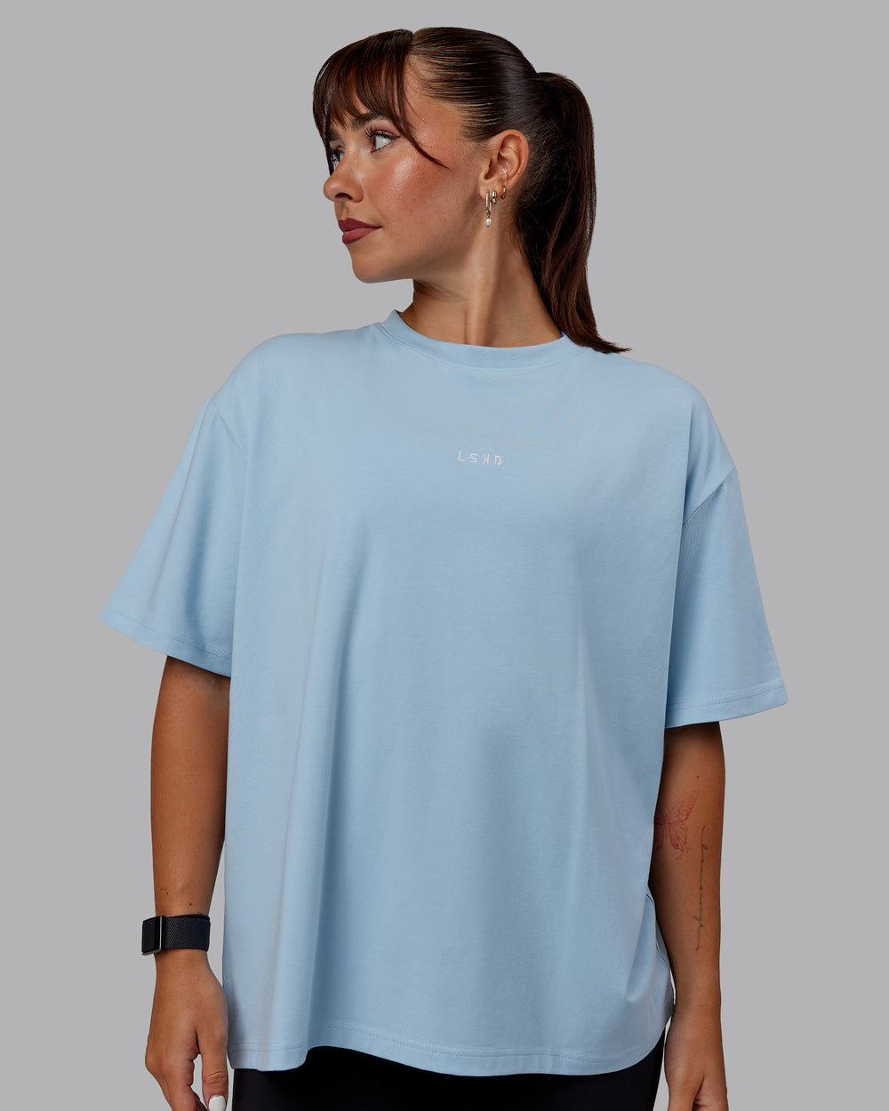 Woman wearing Go-To FLXCotton Oversized Tee - Glacial Blue-White