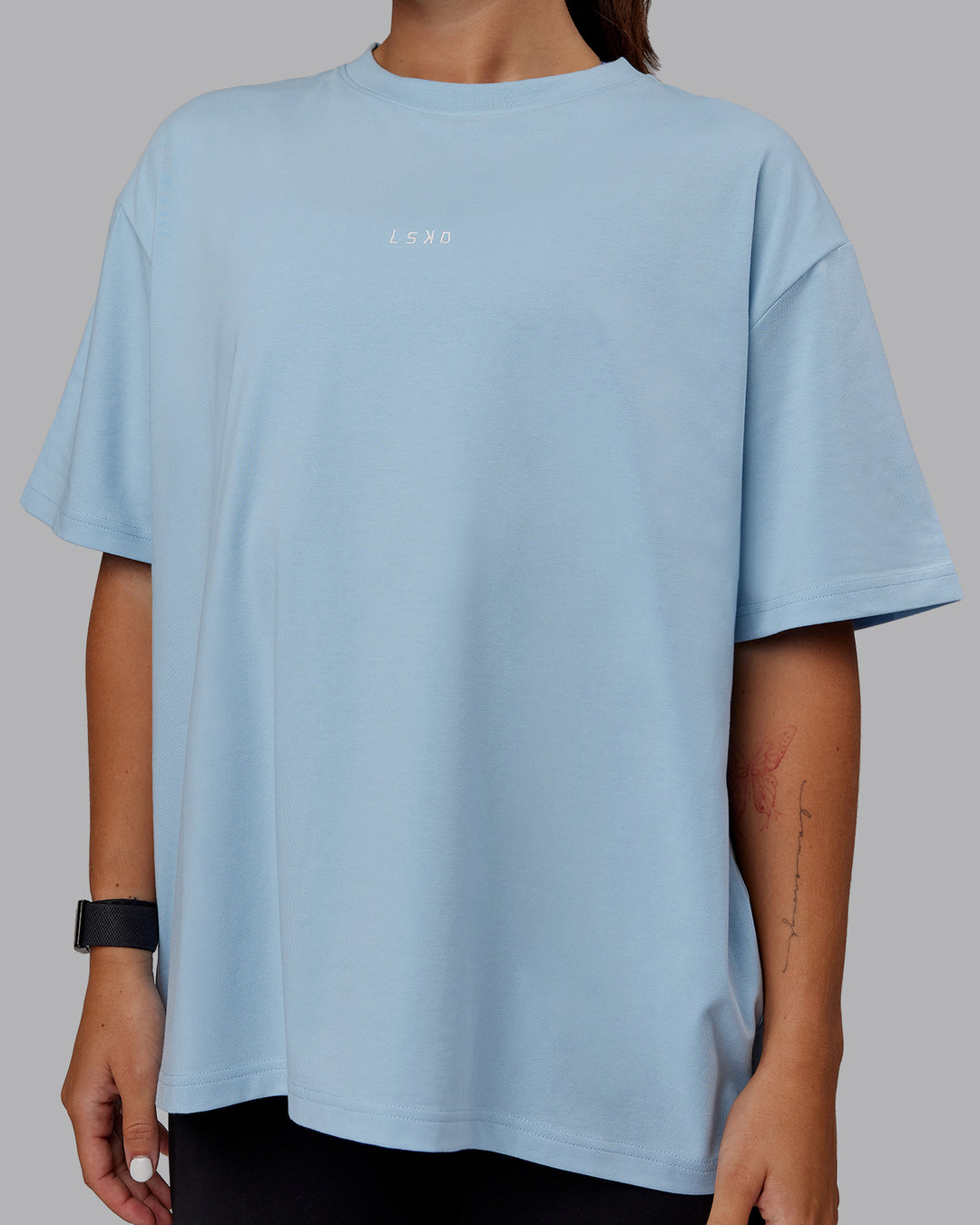 Woman wearing Go-To FLXCotton Oversized Tee - Glacial Blue-White