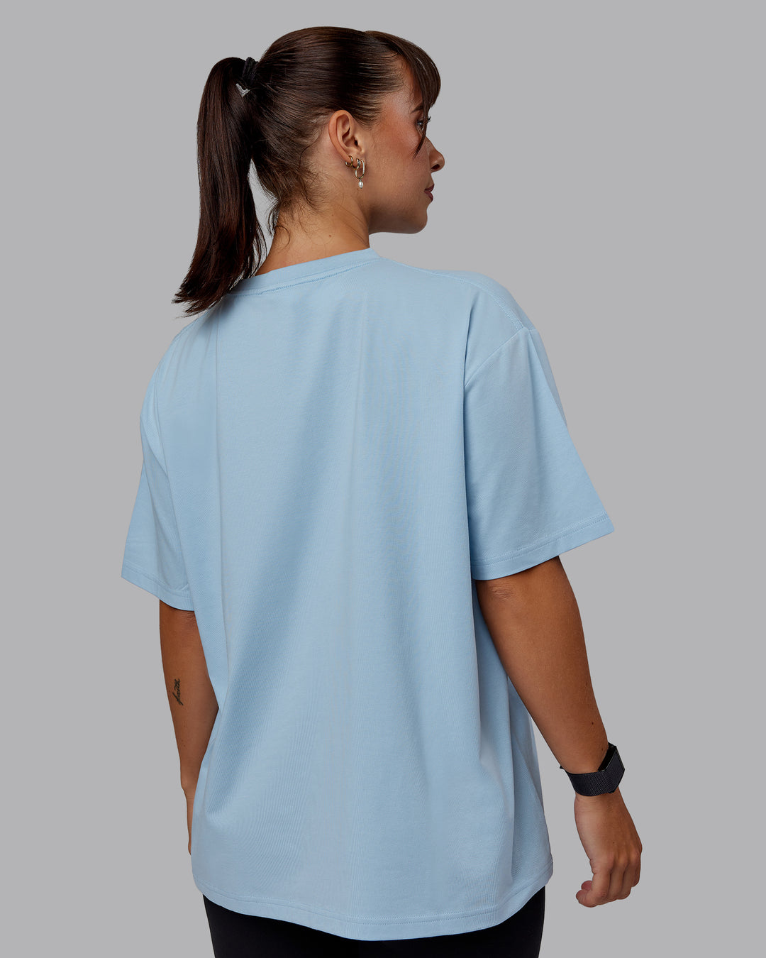 Woman wearing Go-To FLXCotton Oversized Tee - Glacial Blue-White