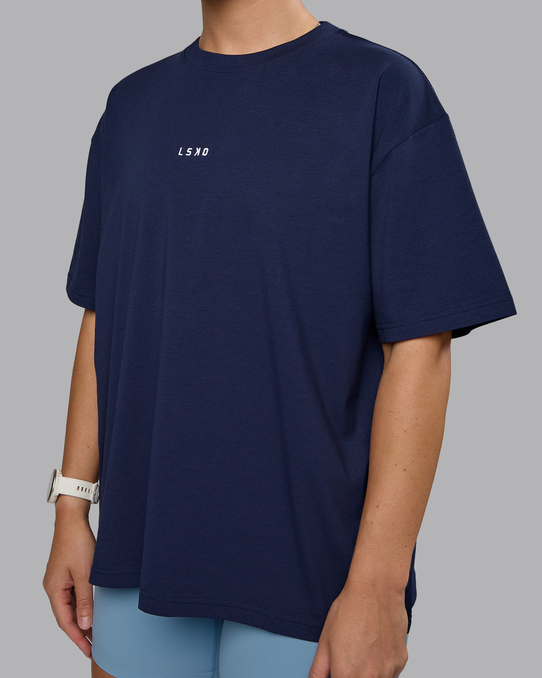 Woman wearing Go-To FLXCotton Oversized Tee - Future Navy-White