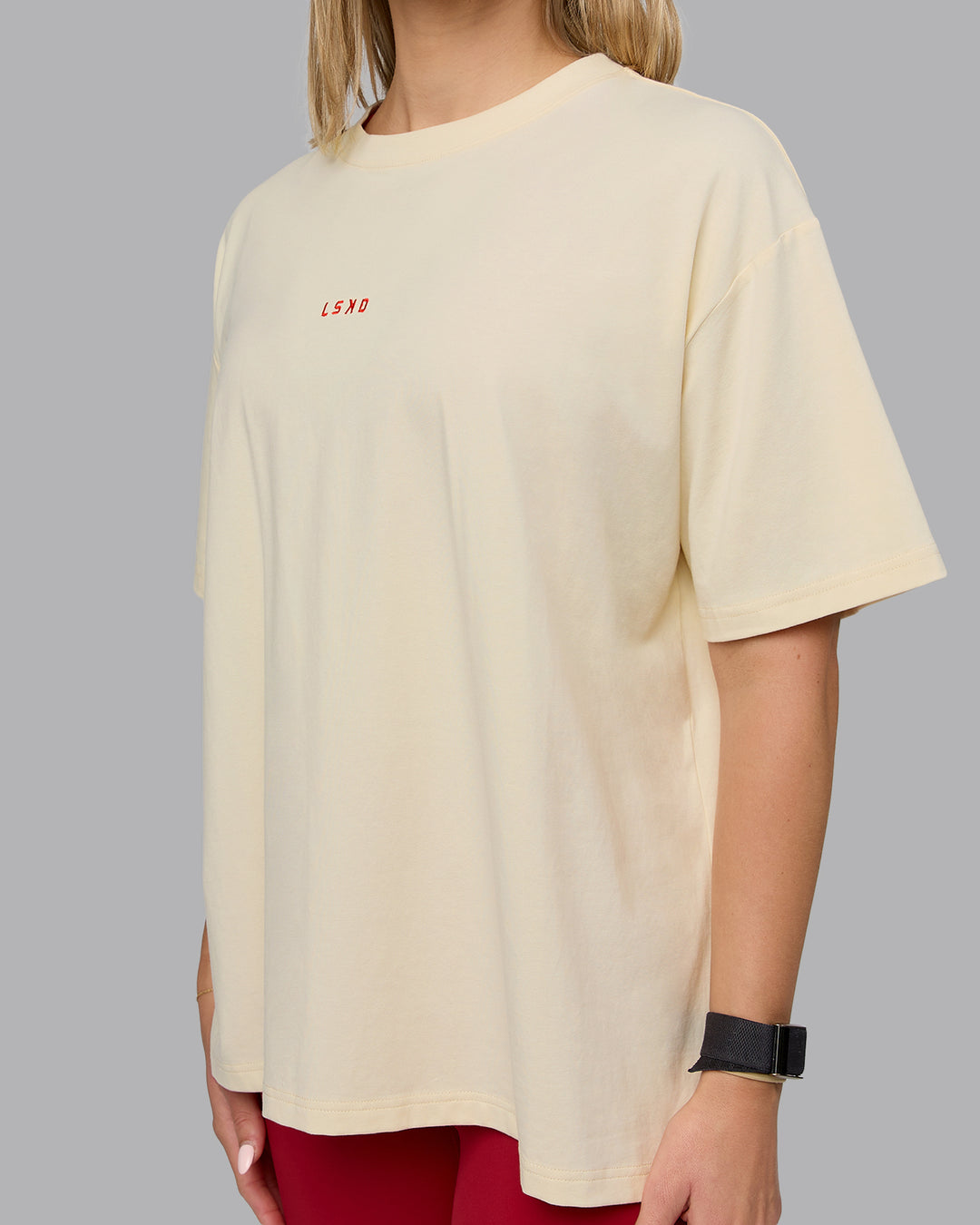 Woman wearing Go-To FLXCotton Oversized Tee - Ivory-Cherry Red